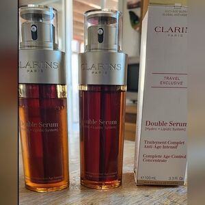 Clarins Double Serum Bottles in Amber and Red